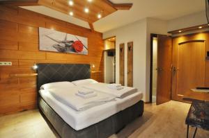 Katil atau katil-katil dalam bilik di Pension & Apartments Weissbriach