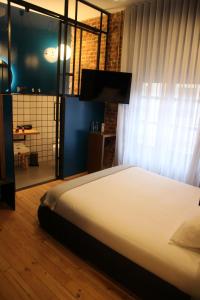 Postel nebo postele na pokoji v ubytování 13 suites