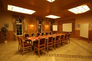 a large conference room with a long table and chairs at Landgasthof Zur Goldenen Aue in Nordhausen