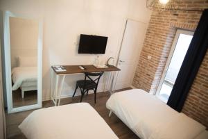 Letto o letti in una camera di Old Bazaar Rooms