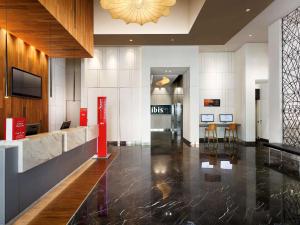 a lobby of a building with a reception desk at Ibis Singapore Novena in Singapore
