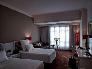 Postel nebo postele na pokoji v ubytování Pullman Hanoi
