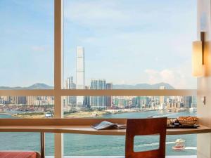 a view of a city skyline from a window at Ibis Hong Kong Central & Sheung Wan in Hong Kong