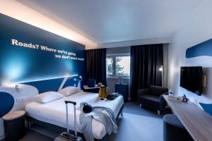 Säng eller sängar i ett rum på ibis Styles Beauvais
