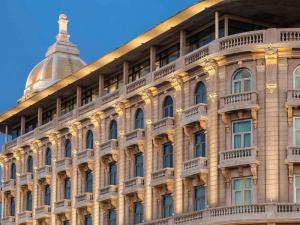 a building with balconies on the side of it at Sofitel Montevideo Casino Carrasco & Spa in Montevideo