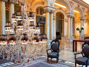 a large room with a chandelier in a building at Sofitel Montevideo Casino Carrasco & Spa in Montevideo +37 photos