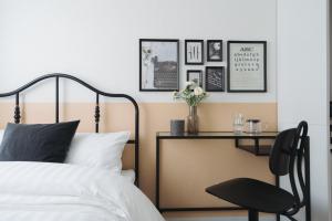 Postel nebo postele na pokoji v ubytování Miyako Shinjuku Hotel 都-新宿-