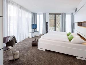 En eller flere senge i et værelse på ibis Styles Nagold-Schwarzwald