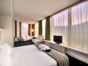 Posteľ alebo postele v izbe v ubytovaní Mercure Nerocubo Rovereto