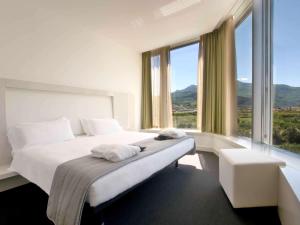 Posteľ alebo postele v izbe v ubytovaní Mercure Nerocubo Rovereto + 37 fotografií