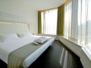 Posteľ alebo postele v izbe v ubytovaní Mercure Nerocubo Rovereto