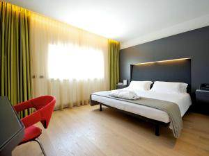 Posteľ alebo postele v izbe v ubytovaní Mercure Nerocubo Rovereto