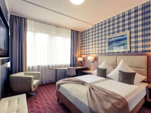 Postel nebo postele na pokoji v ubytování Mercure Hotel Kaiserhof City Center