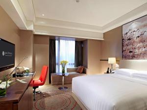 Llit o llits en una habitació de Pullman Xiamen Powerlong