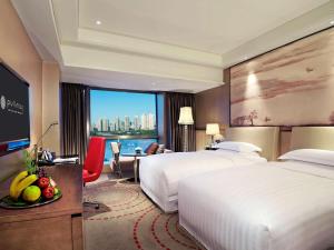 Llit o llits en una habitació de Pullman Xiamen Powerlong