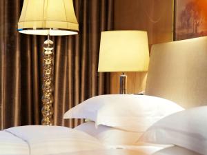 Llit o llits en una habitació de Pullman Xiamen Powerlong