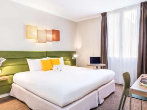 Voodi või voodid majutusasutuse Matabi Hotel Toulouse Gare by HappyCulture toas
