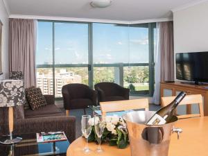 A seating area at The Sebel Sydney Chatswood