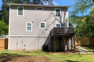 a large house with a garage in front of it at Modern Home:3 Bedroom;2.5 Bath Near M-Benz Stadium in Atlanta