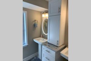 a bathroom with a sink and a mirror at Modern Home:3 Bedroom;2.5 Bath Near M-Benz Stadium in Atlanta +20 photos