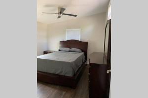 a bedroom with a bed and a ceiling fan at Modern Home:3 Bedroom;2.5 Bath Near M-Benz Stadium in Atlanta