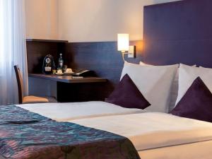 Cama ou camas em um quarto em Mercure Frankfurt City Messe