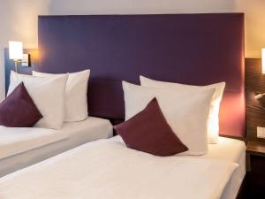 Cama ou camas em um quarto em Mercure Frankfurt City Messe
