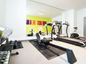 a gym with treadmills and exercise equipment in a room at ibis Styles Hotel Brussels Centre Stéphanie in Brussels