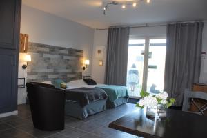 Postel nebo postele na pokoji v ubytování Hotel La Peyrade