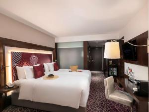 Postelja oz. postelje v sobi nastanitve Novotel Yangon Max