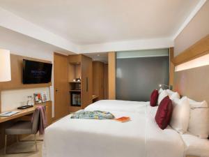Postelja oz. postelje v sobi nastanitve Novotel Yangon Max