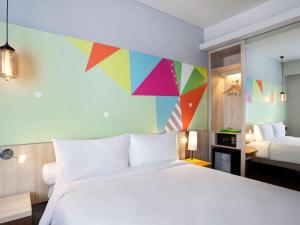 Voodi või voodid majutusasutuse Ibis Styles Jakarta Sunter toas