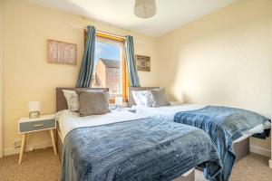 Tempat tidur dalam kamar di Broughty Ferry Apartment