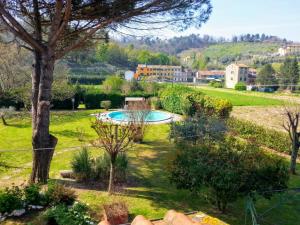 a view of a garden with a swimming pool at Casa Pilar in Capannori