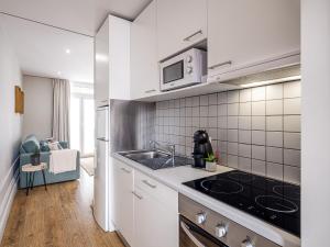 Kuchyň nebo kuchyňský kout v ubytování Oporto View Apartments