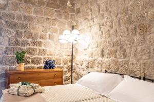Postel nebo postele na pokoji v ubytování Torre dei Belforti
