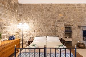 Postel nebo postele na pokoji v ubytování Torre dei Belforti