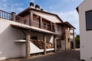 a building with balconies on the side of it at A. Montesinho Turismo in Bragança