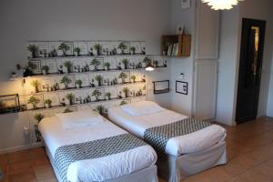 Postel nebo postele na pokoji v ubytování Hotel La Peyrade