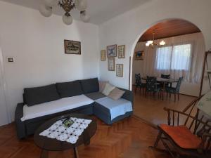 a living room with a couch and a table at Villa Agata in Lastovo