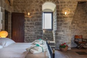 Postel nebo postele na pokoji v ubytování Torre dei Belforti