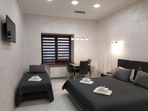 Ένα ή περισσότερα κρεβάτια σε δωμάτιο στο RynOK 25 Elite Lviv Center