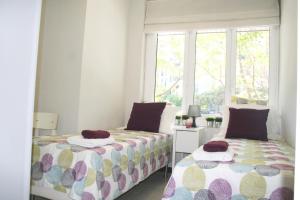 Katil atau katil-katil dalam bilik di Apartment Carrer Lepant