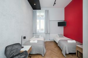 Televízia a/alebo spoločenská miestnosť v ubytovaní Rainbow Apartments 3
