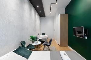 Televízia a/alebo spoločenská miestnosť v ubytovaní Rainbow Apartments 3