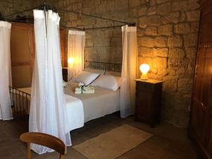 Postel nebo postele na pokoji v ubytování Torre dei Belforti