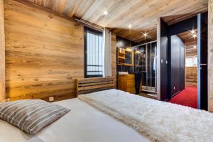 Ένα ή περισσότερα κρεβάτια σε δωμάτιο στο Appartement d'exception Tignes