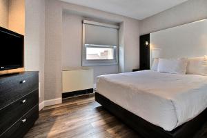 Ένα ή περισσότερα κρεβάτια σε δωμάτιο στο Hotel Classique