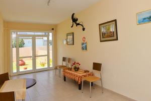 a dining room with a table and chairs at Despoina in Skiathos Town