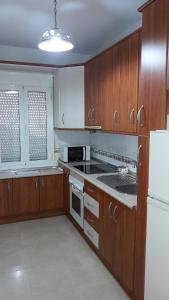 Kuchyň nebo kuchyňský kout v ubytování Apartamento primera linea vistas al mar + 13 fotografií